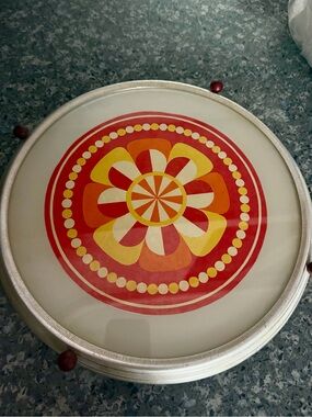 Vintage Rotating Cake Pastry Stand features a vibrant flower power pattern.  60s